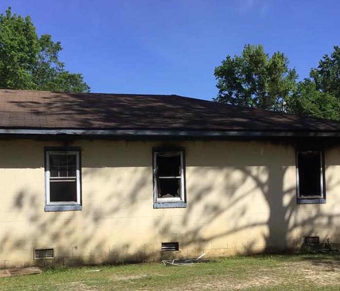 fire damaged home before board up